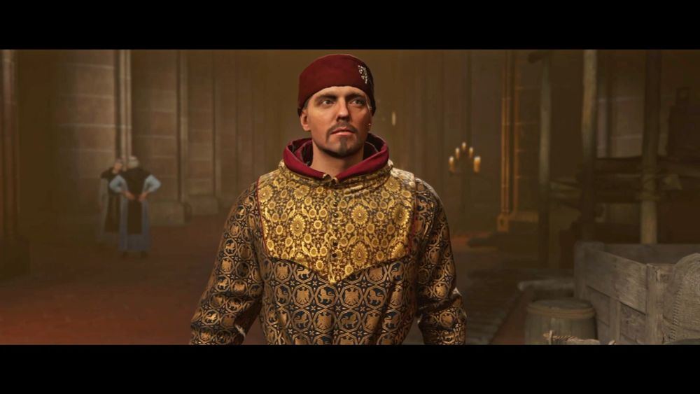 Man in ornate medieval robe and red cap stands in a dim stone hall, candles and crates nearby, two figures blurred in the background.
