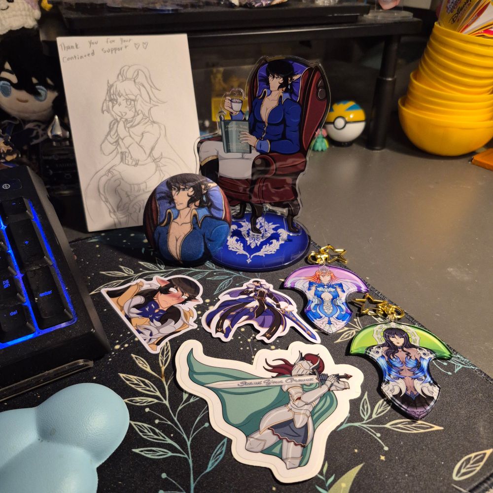A standee and plush button badge of Aymeric. Charms of Ryne and Gaia in their oracle transformations. Two stickers of Aymeric and one of a knight with a sword engraved with "Stand Your Ground". And a drawing of my Warrior of Light Rose