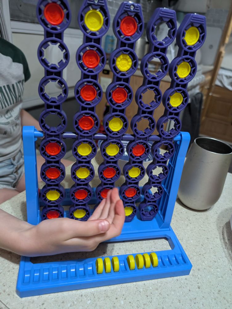 Connect 4 Spin with Elsie's hand in the way