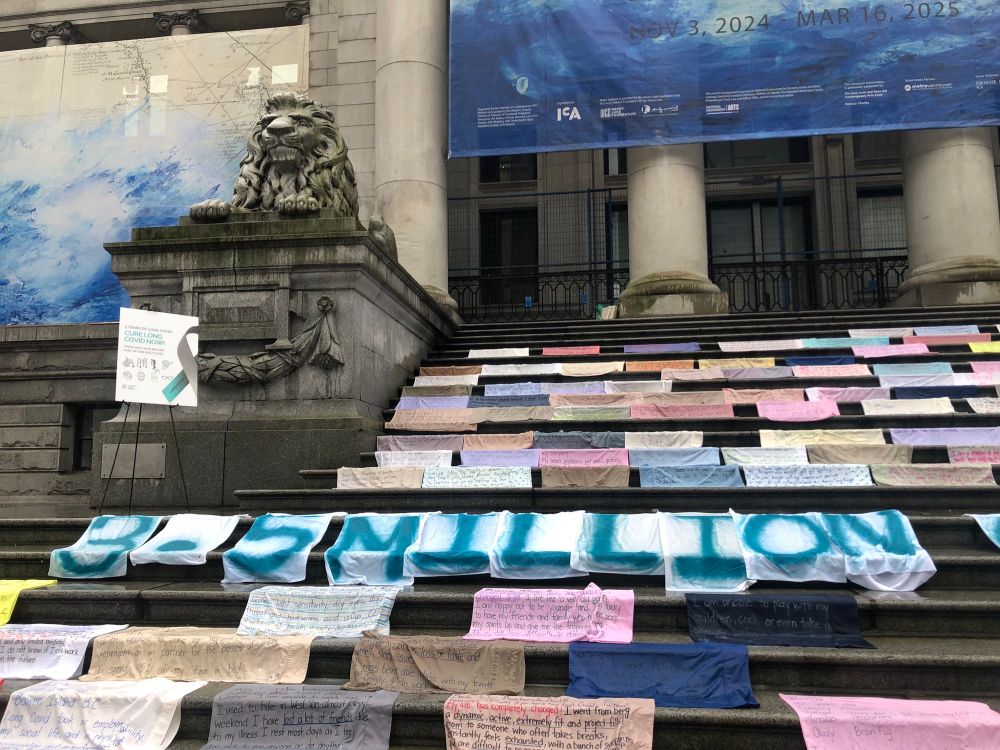 Display of colorful pillowcases with words of suffering written on them by Canadian long Covid victims - displayed outside the Vancouver Art Gallery in honor of International Long Covid Day
