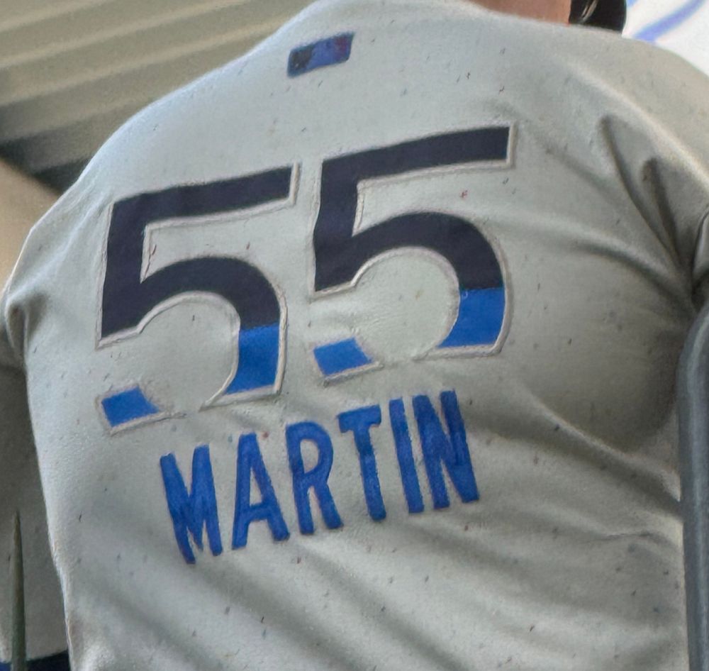 Back of a Dodger City Connect jersey for former catcher Russell Martin. The name Martin is written under the number 55