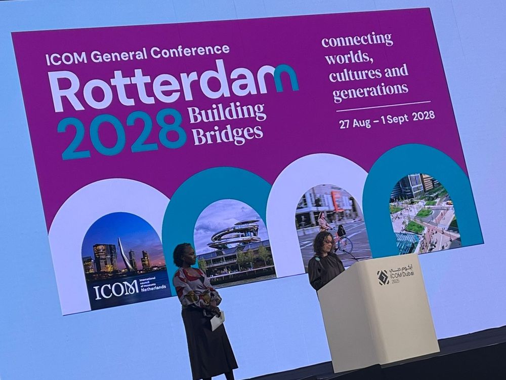 Picture of the ICOm 2025 stage in Dubai with the conference announcement for 2028 Rotterdam. Building bridges. Connecting worlds, cultures and generations. 27 Aug - 1 Sept