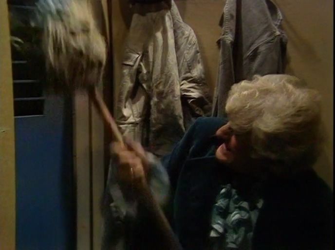 Jon Pertwee fighting with a mop