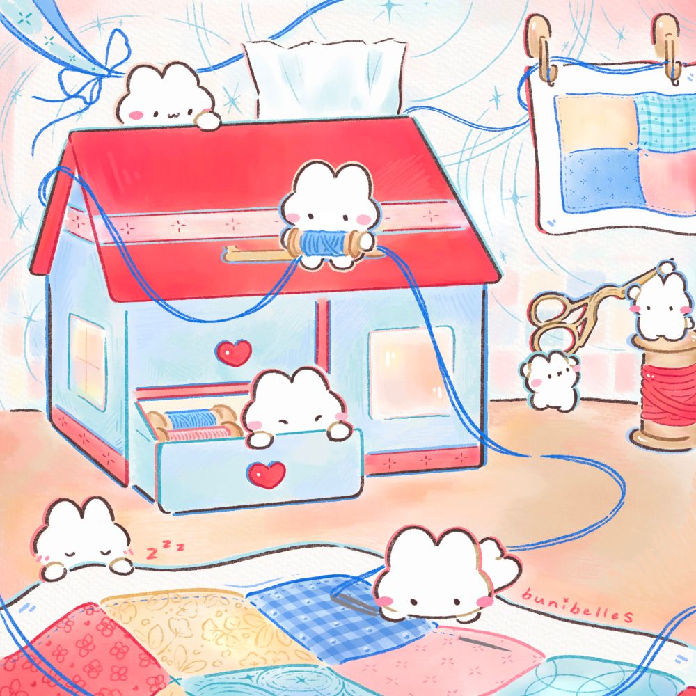 Bunnies working on a quilt together! There is a house shaped storage box in the background while the quilt is in the front <3