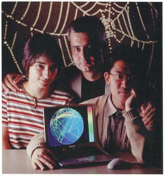 A photo taken for Business 2.0 magazine in 2000, showing Réka Albert, Hawoong Jeong and Albert-László Barabási after publication of their paper on the topology of the World Wide Web.
