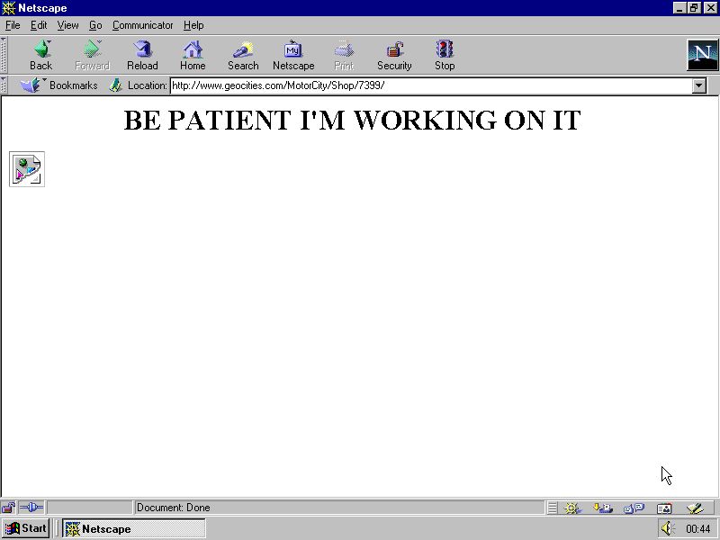 A broken web page in an old Netscape browser with a gif that didn't load and text that reads "BE PATIENT I'M WORKING ON IT"