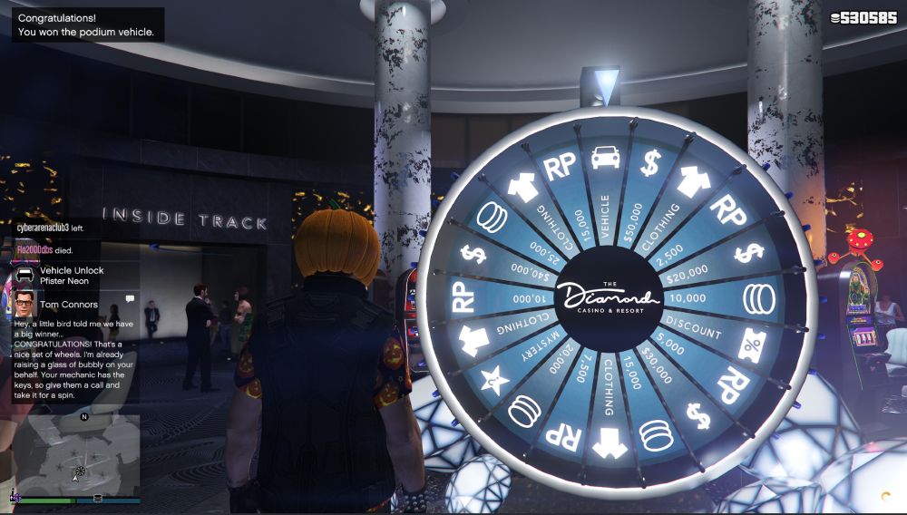 My character (who is dressed in a pumpkin head, pumpkin shirt, and armored vest) winning the car at the casino in GTA Online today