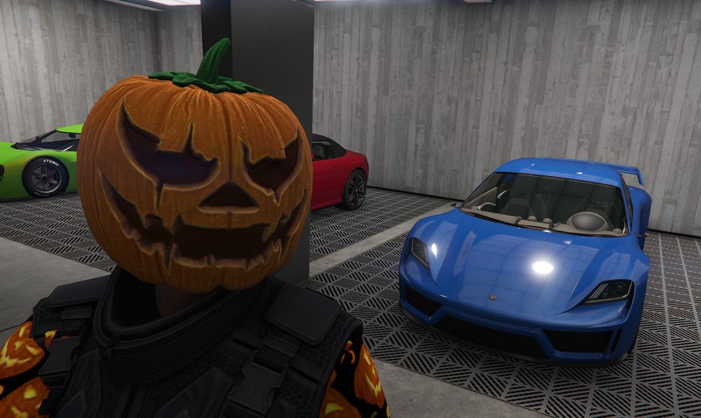My GTA Online character (who is dressed as a pumpkin) standing in front of a freshly customised blue Pfister Neon car I won