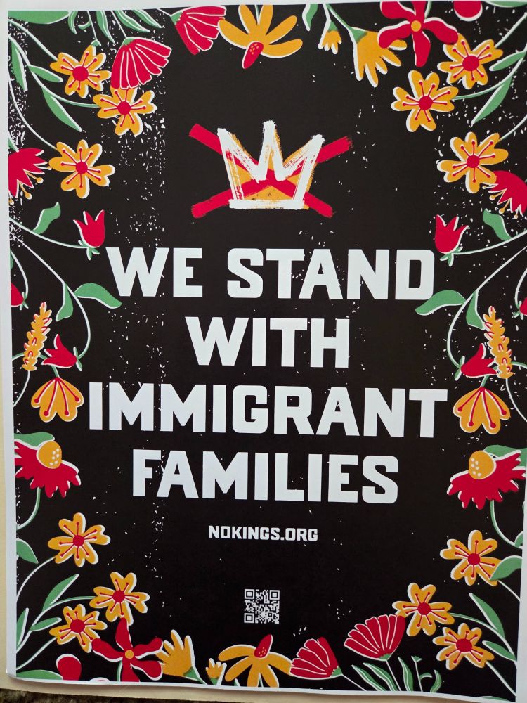 We strand with immigrant families nokings.org with black background surrounded by flowers. 