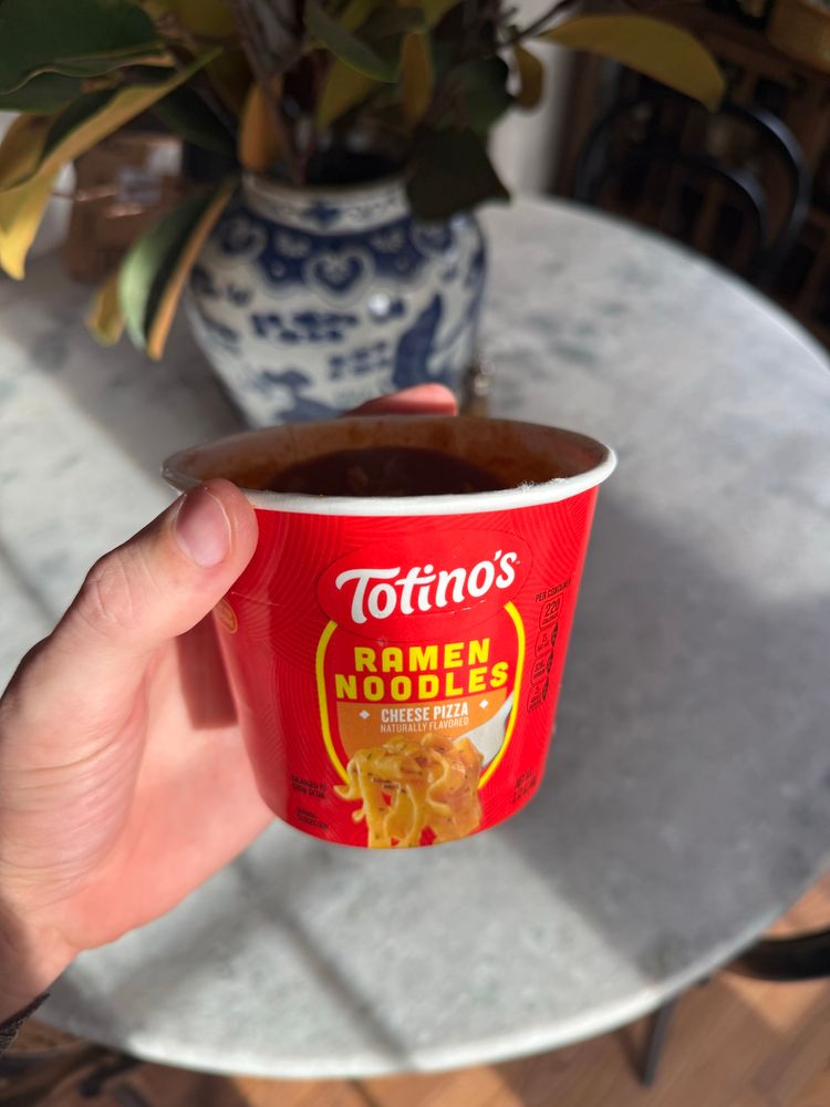 A cup of Totino’s Cheese Pizza Ramen Noodles