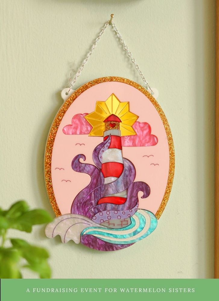 Photo of acrylic wall art of a lighthouse wrapped in tentacles