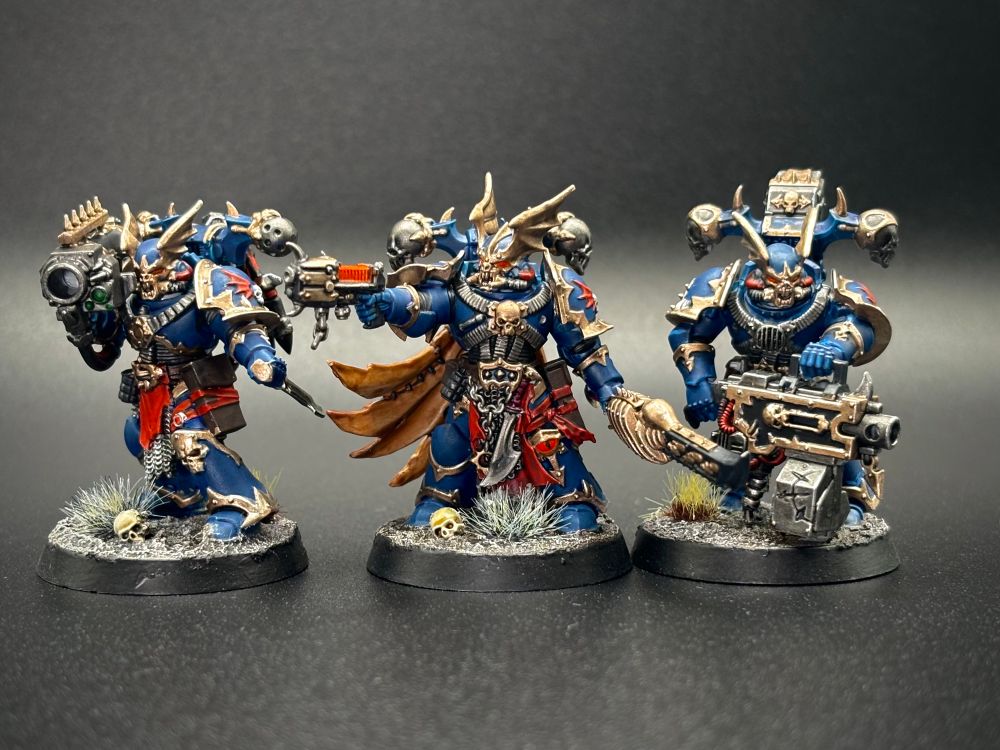 Nightlord Heavy Gunners and Champion painted on black background. 
