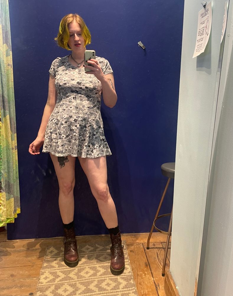 Mirror selfie of me in gray floral dress and burgundy boots