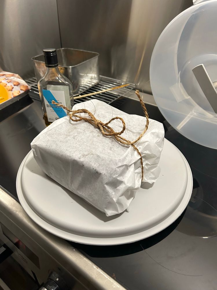 Christmas cake fed with Brandy and wrapped in greaseproof paper 