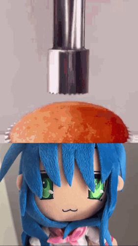 a stuffed doll with blue hair and green eyes is holding a hamburger on top of her head