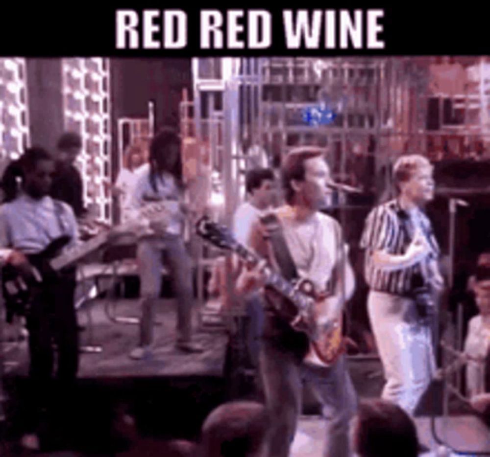 a group of people are playing instruments on a stage and the words red red wine are above them