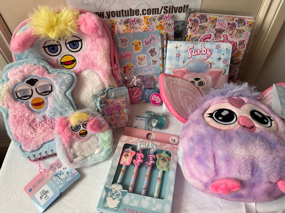 Photo of a collection of Furby themed items including stationary