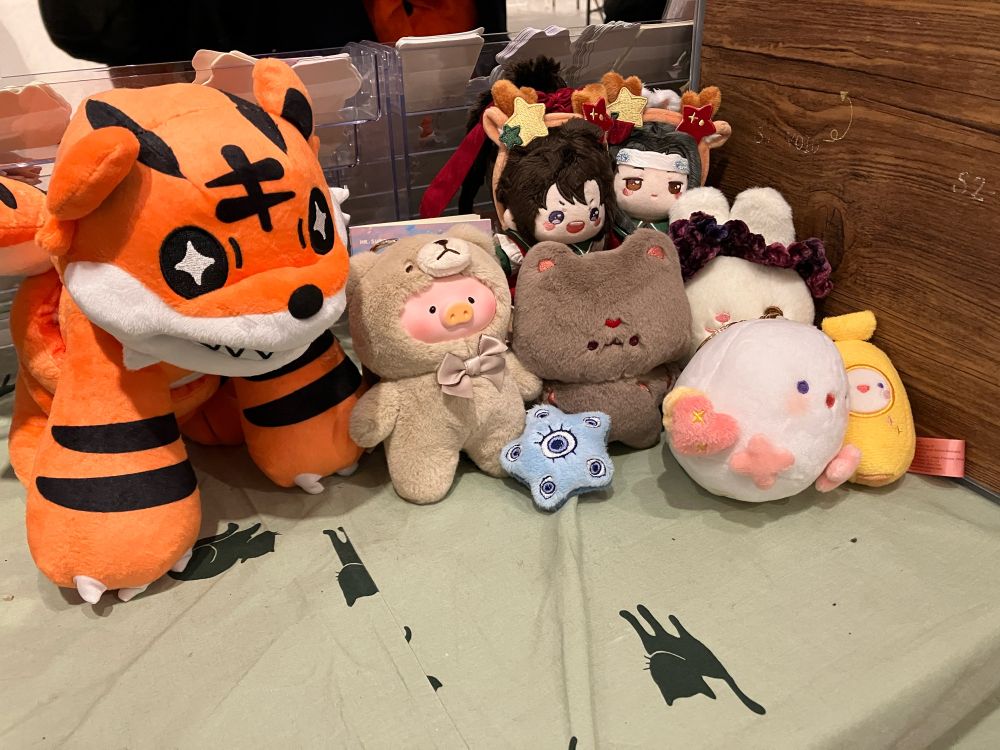 photo of 9 plushie on a green table cloth 