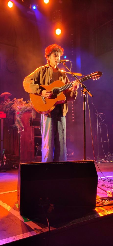 aron! with an acoustic guitar on stage in hamburg