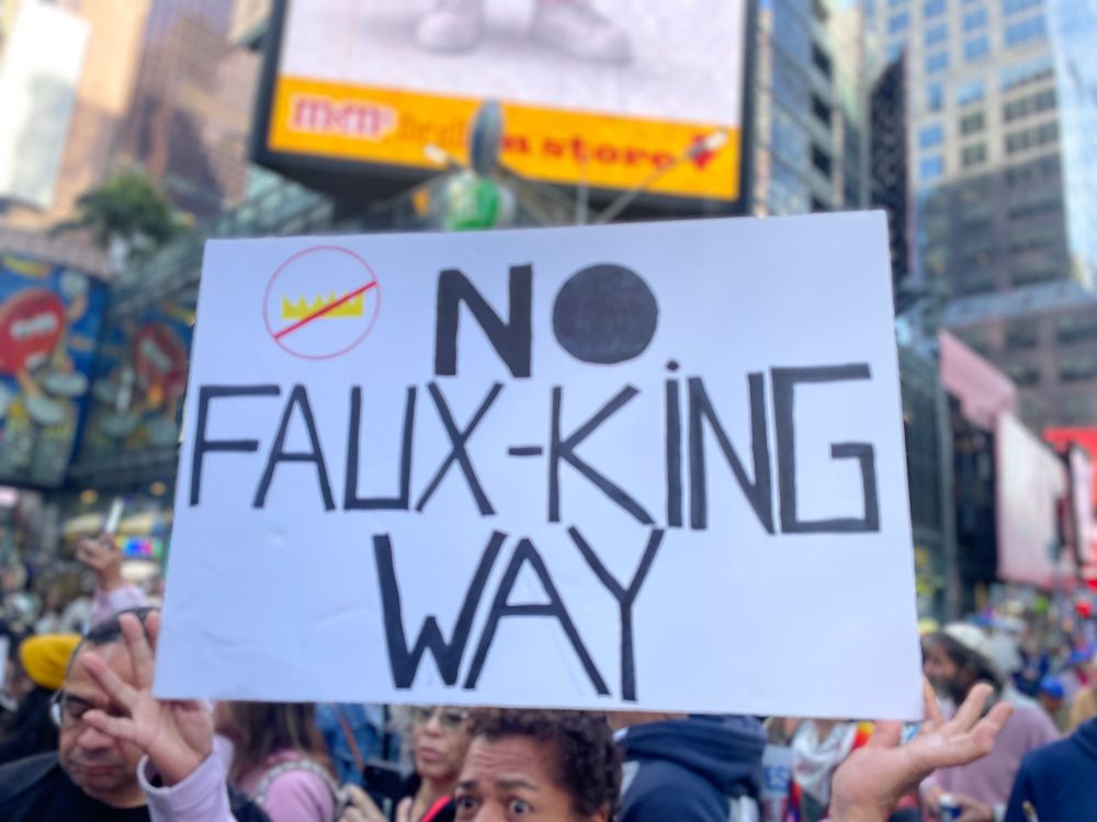 A protest sign that says “No Faux-King Way”