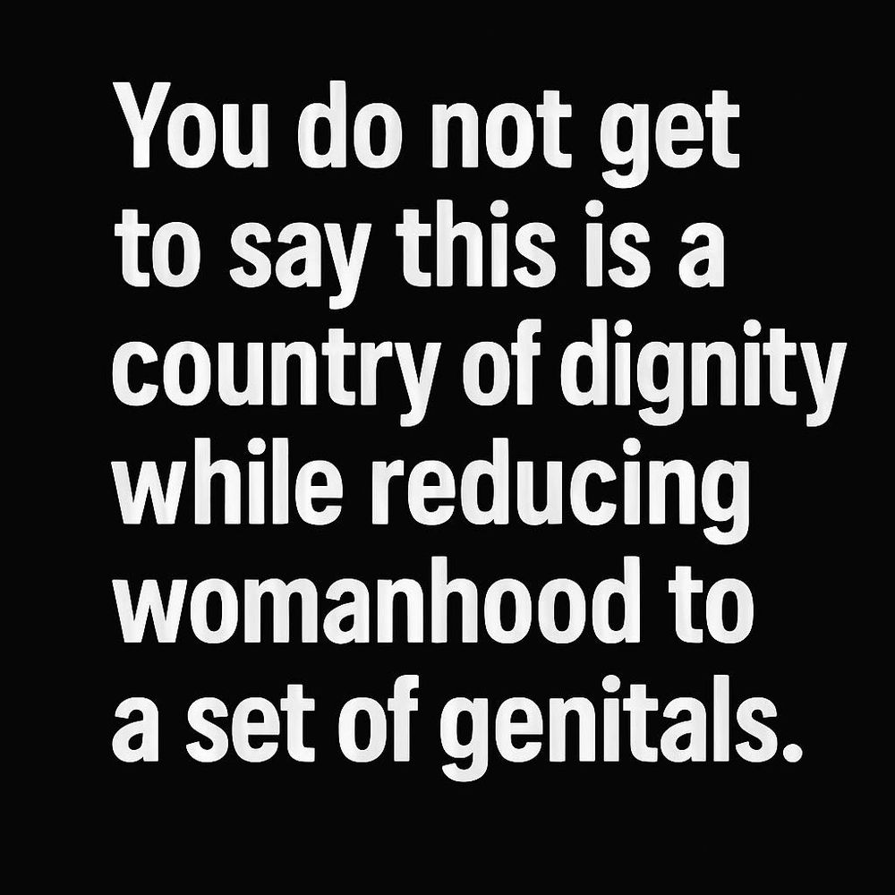 reducing womanhood to genitals a black and white poster from daniel lismore on facebook