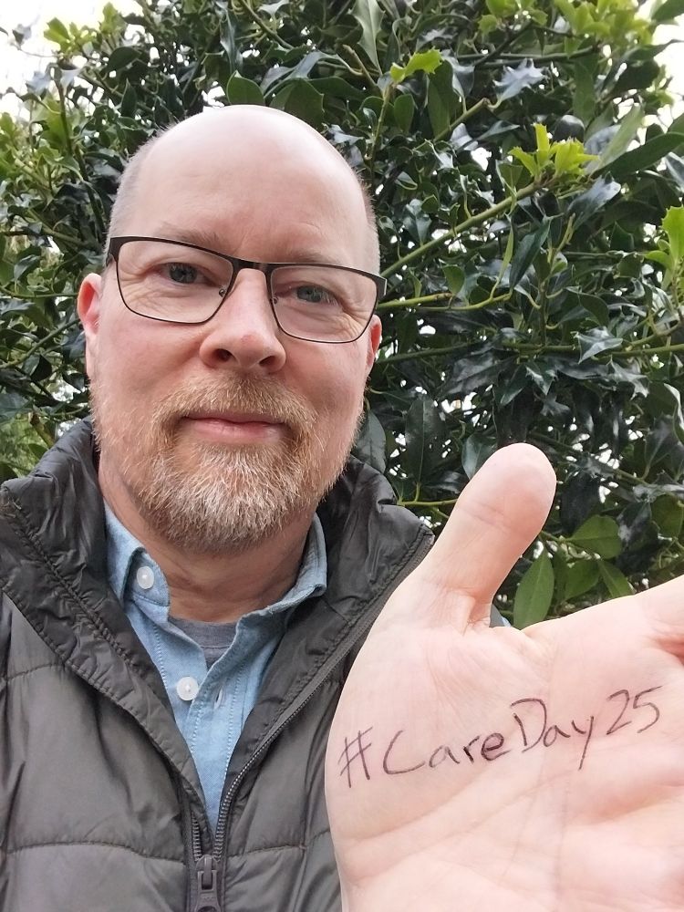 Avery Bowser with ##CareDay25 written on his hand