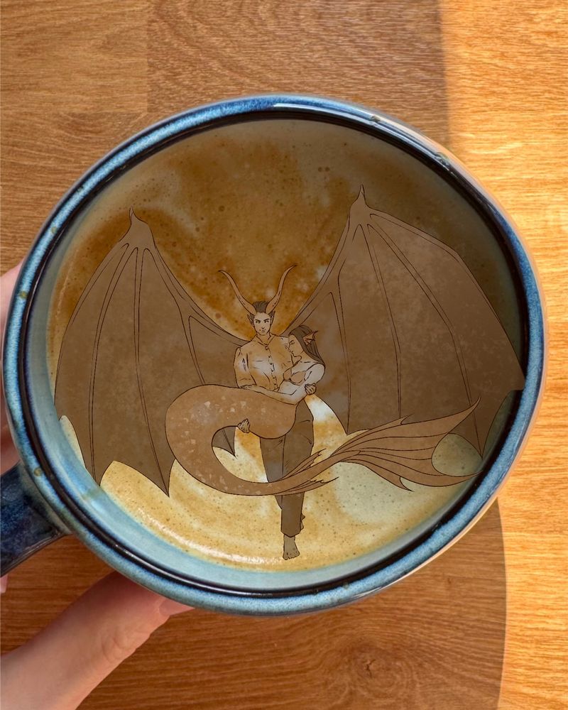 A digital sketch I drew based on what I could "see" in the milk foam. I can see two fantasy creatures: a winged demon carrying a mermaid.