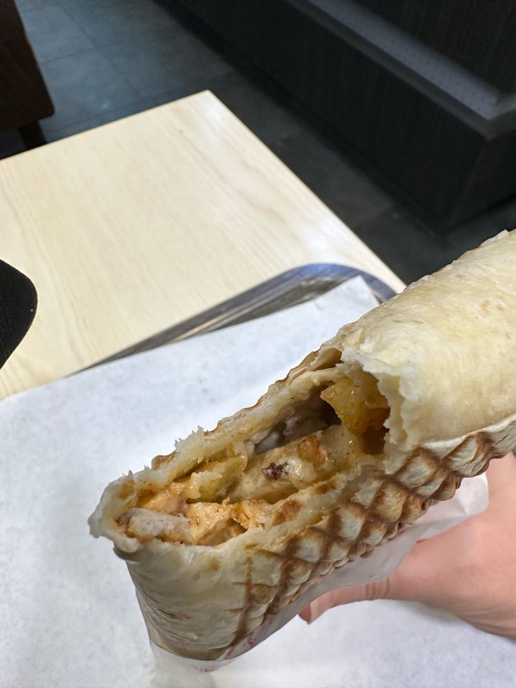 Cross-section/bite out of a French Tacos