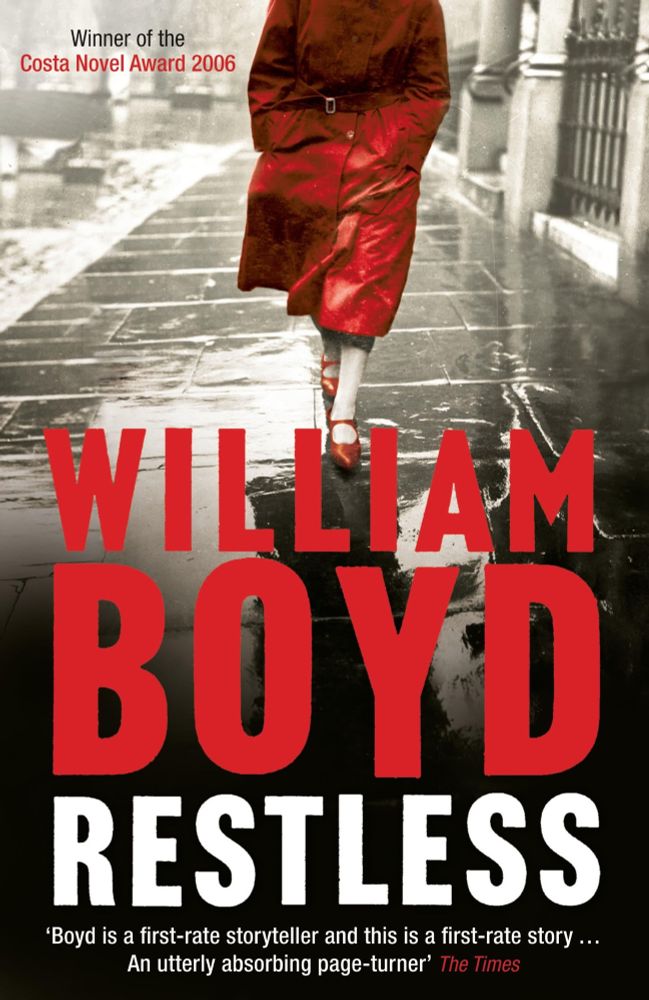 Cover of the book Restless by William Boyd, depicting a woman in a red coat walking along a rain-soaked street. 
