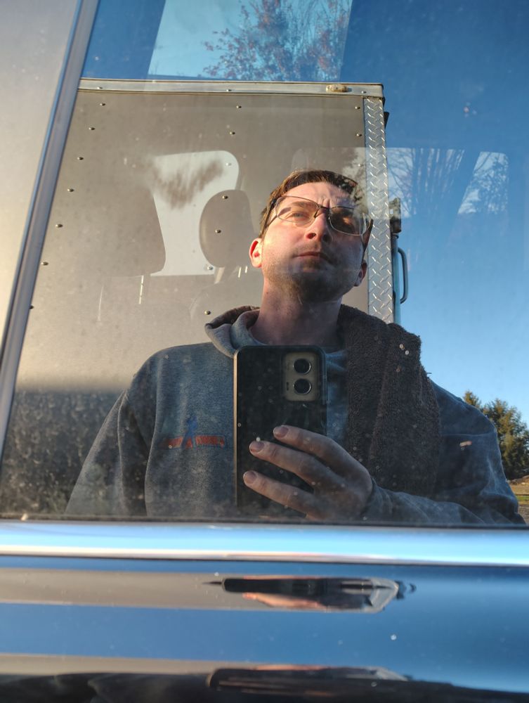 My face again, but closer to what I was seeing reflected in my car window.