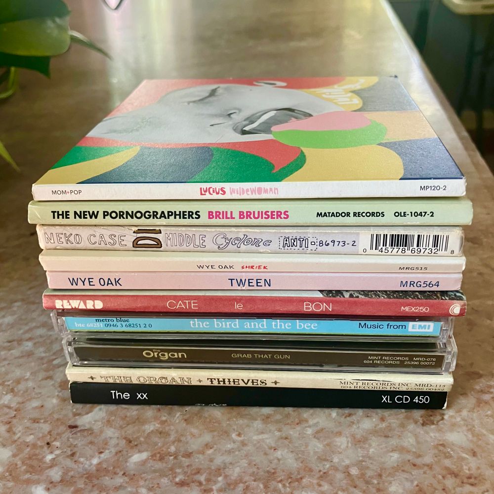 A stack of CDs:

Lucius, Wildewoman
The New Pornographers, Bill Bruisers
Neko Case, Middle Cyclone
Wye Oak, Shriek 
Wye Oak, Tween
Cate Le Bon, Reward
The Bird and the Bee
The Organ, Grab That Gun
The Organ, Thieves
The xx