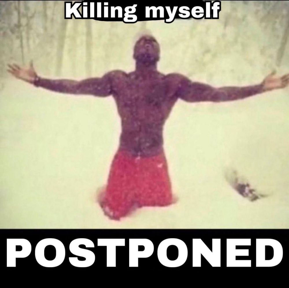 a shirtless man in the snow with his arms outstretched and text that reads "killing myself postponed"