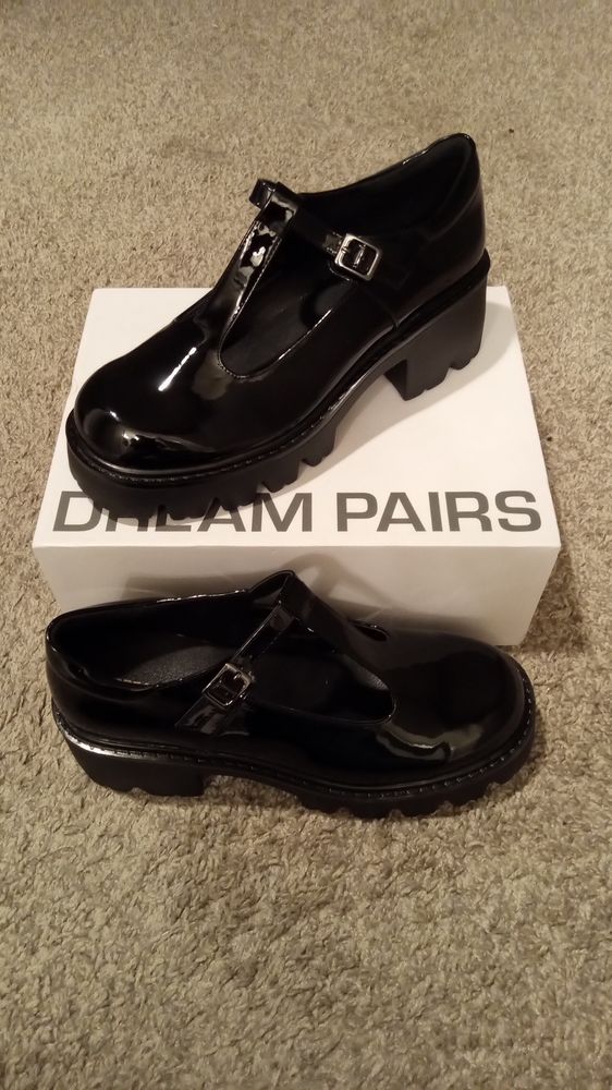 Pair of black faux patent leather Mary Jane platform shoes, sold by dreampairs.com