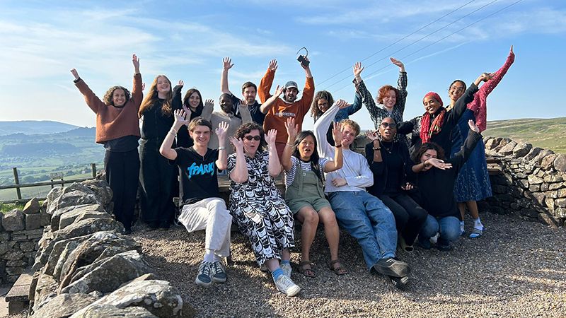 Group shot of trainees hands in the air