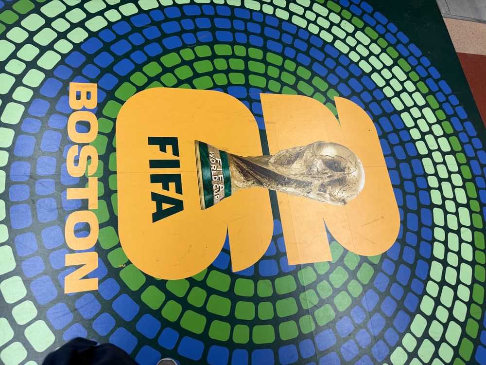 An advertisement on the floor of South Station in Boston „FIFA 26 Boston“