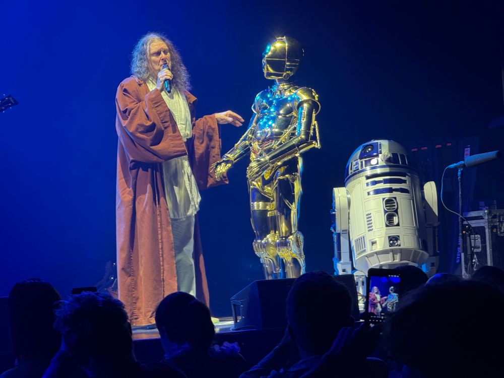 Weird Al dressed as a Jedi with C3p0 and r2d2 at the wang center in Boston 