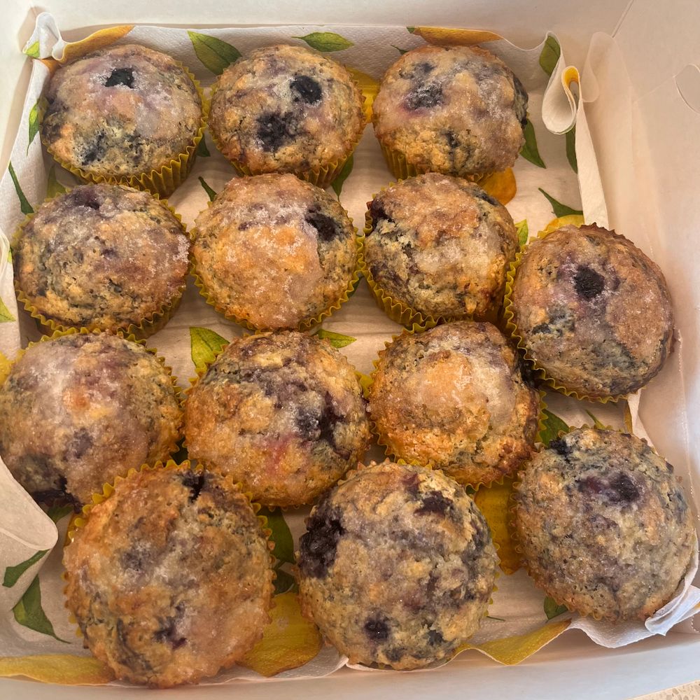 A box of lemon and blueberry muffins