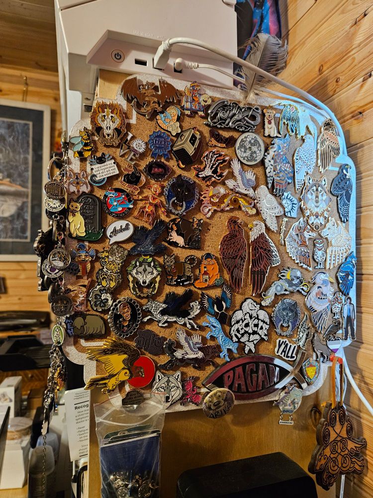 Piece of cork board about 13 x 13 inches chock full of pins fitted together like a puzzle.