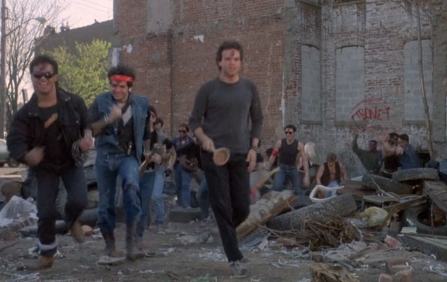 Scene from Death Wish 3 prominently featuring an actor out of costume with a plunger as a weapon.
