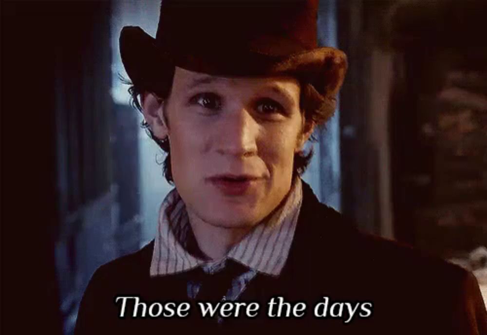 a man wearing a top hat and a striped shirt says those were the days