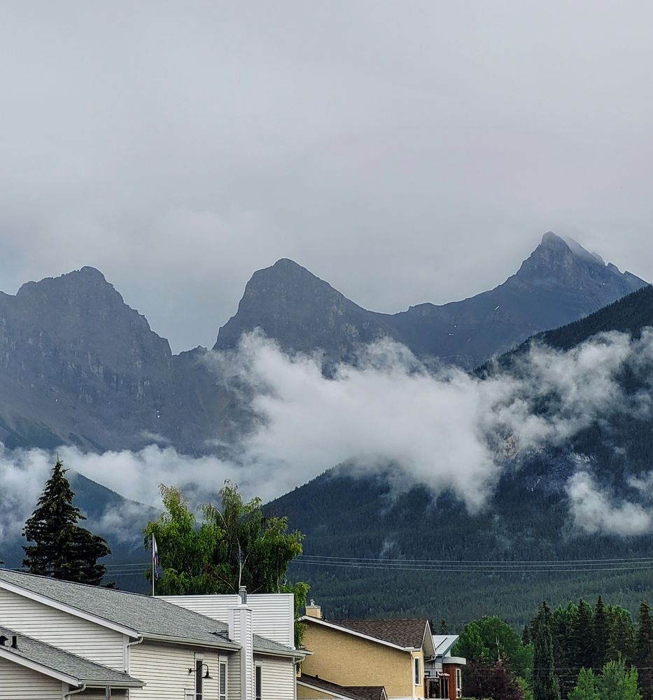 A photo of the view of the Three Sisters over Canmore, AB.