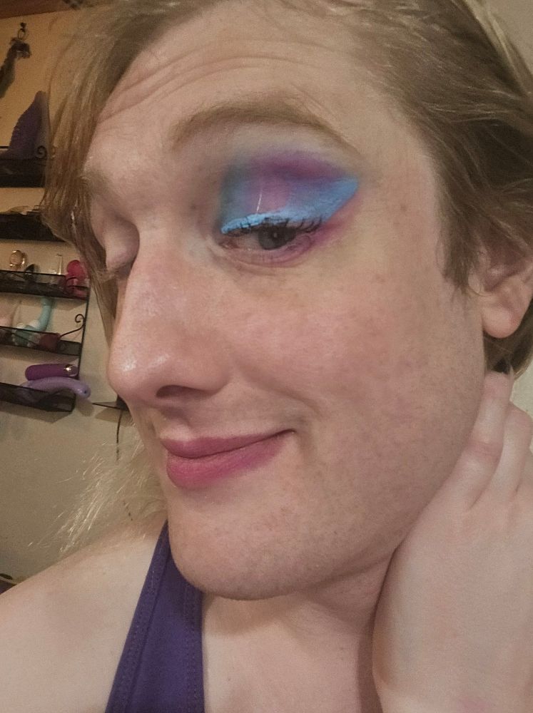 Image of blonde woman with blue and purple blended eyeshadow