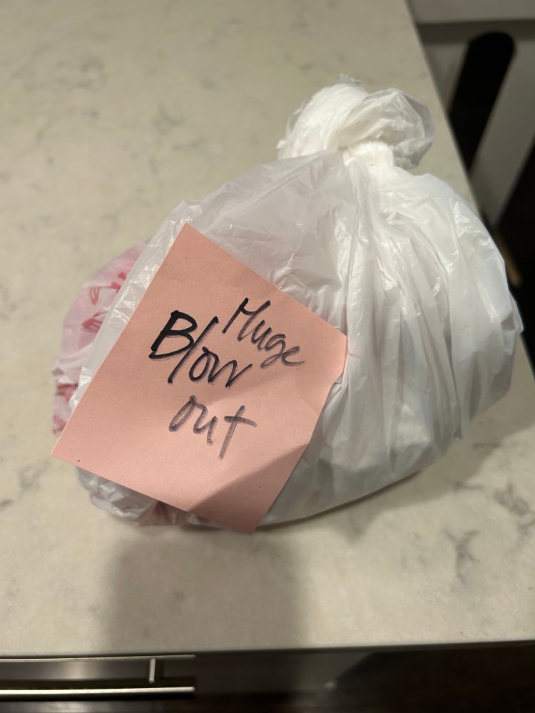 Plastic bag marked “huge blow out”
