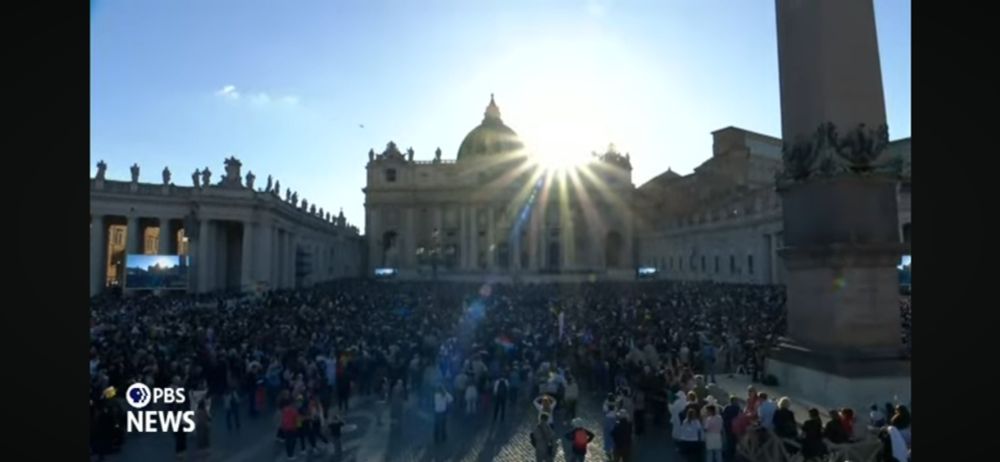 Sun rays shine from behind St. Peter’s in Rome 