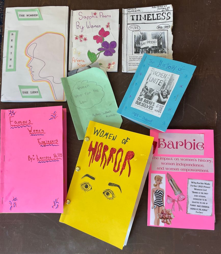 Starter zines by Intro to Women’s Studies students including on with a bright yellow cover with the title Women of Horror in blood dripping text