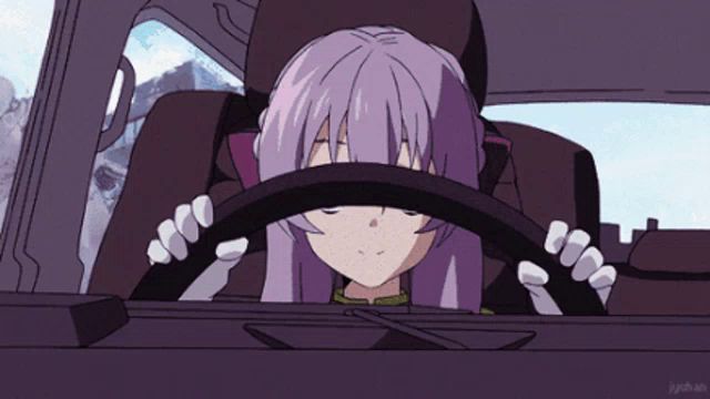 a girl with purple hair is sitting in a car