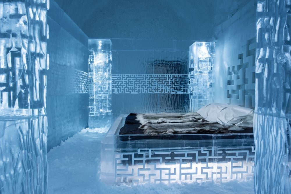 A bedroom inside an ice hotel.