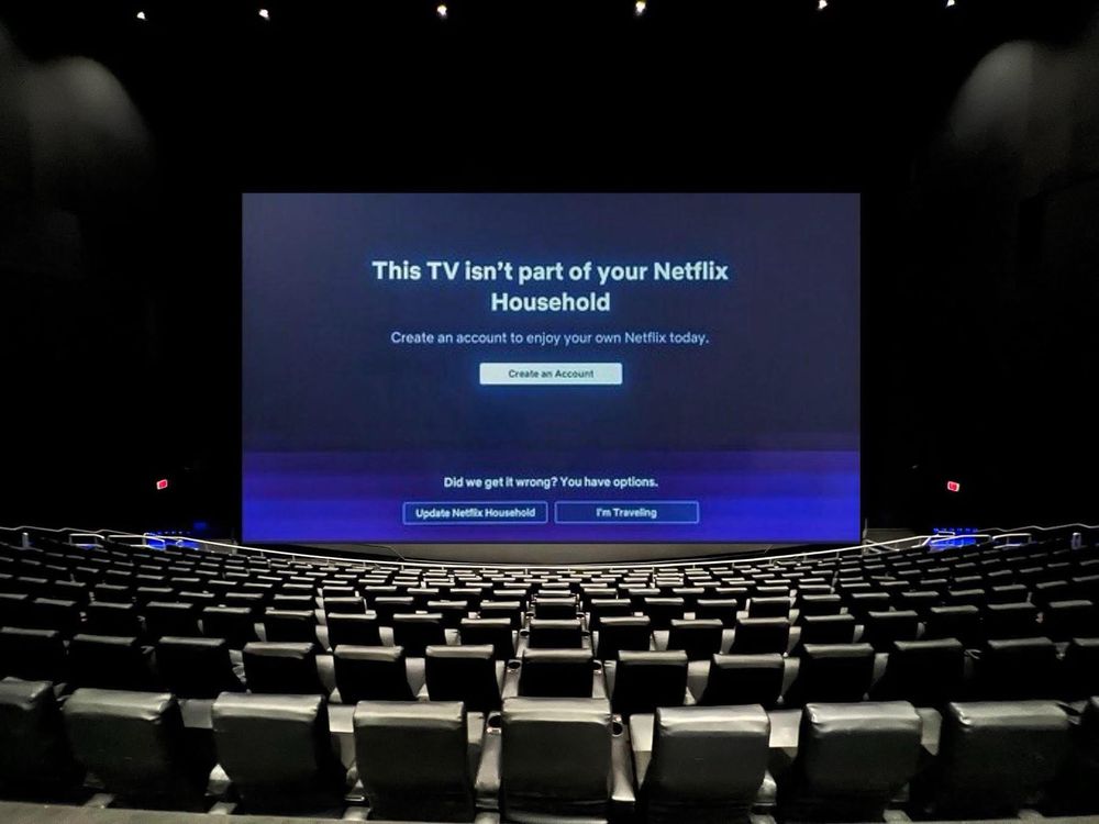 A movie theater screen with a Netflix error screen on it.