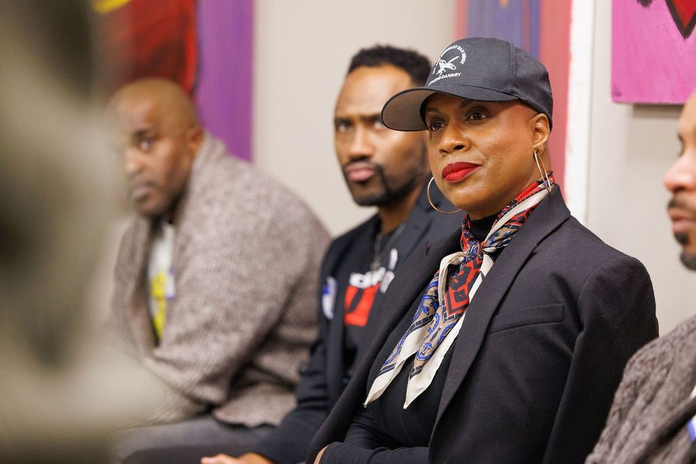 Rep. Ayanna Pressley listens attentively.
