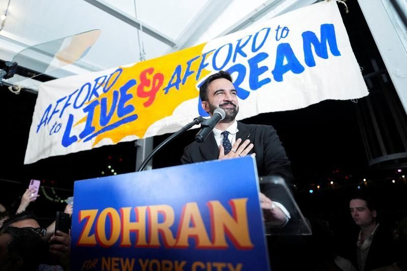 Zohran Mamdani stands at a podium and thanks supporters at his election night victory party.